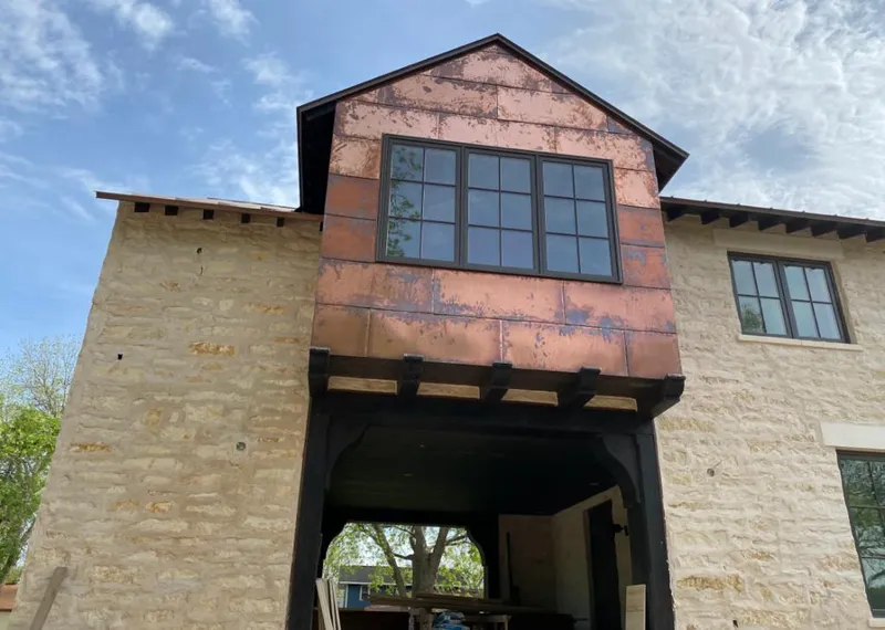 Copper metal panel facade on a stone building for Roof Repair in Duanesburg